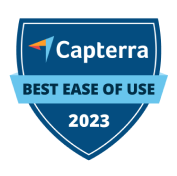 Blue shield-shaped badge with the Capterra logo, labeled "Best Ease of Use 2023.